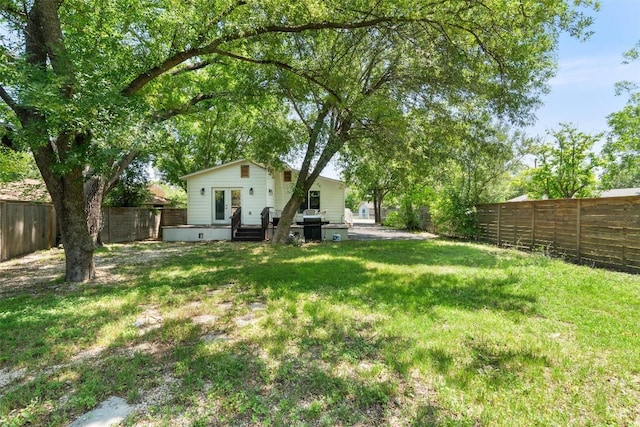 306 Juarez St, San Marcos, TX 78666 - view of yard featuring french doors