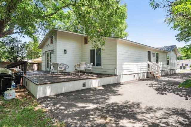 306 Juarez St, San Marcos, TX 78666 - rear view of property with a deck