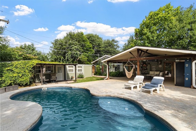 106 Apache Trl, Kingsland, TX 78639 - outdoor pool featuring a patio and an outdoor structure