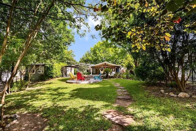 106 Apache Trl, Kingsland, TX 78639 - view of grassy yard featuring a patio area