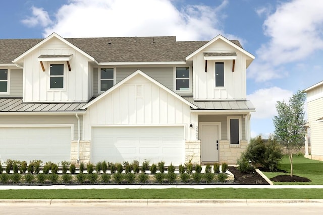 2585 Jack Nora Way, Round Rock, TX 78665 - view of front facade with a standing seam roof, a shingled roof, stone siding, and board and batten siding