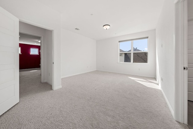 1928 Portobello Rd, Leander, TX 78641 - carpeted empty room featuring healthy amount of natural light