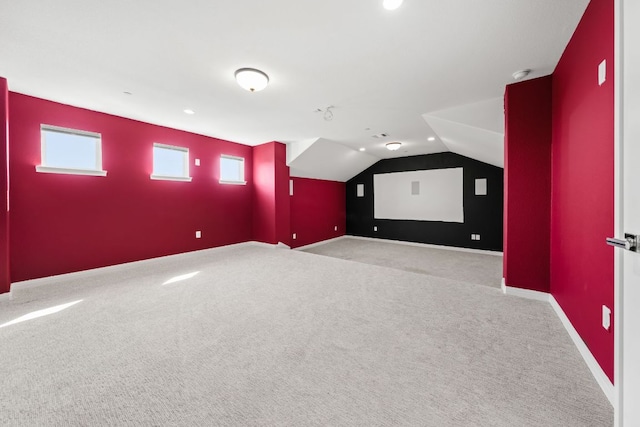 1928 Portobello Rd, Leander, TX 78641 - carpeted home theater room with vaulted ceiling and recessed lighting