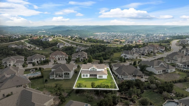 1928 Portobello Rd, Leander, TX 78641 - aerial perspective of suburban area featuring property parcel outlined and mountains