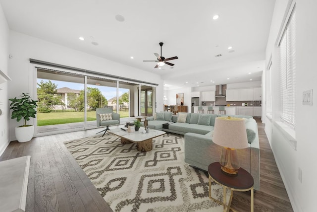 1928 Portobello Rd, Leander, TX 78641 - living area featuring light wood-type flooring, a ceiling fan, plenty of natural light, and recessed lighting