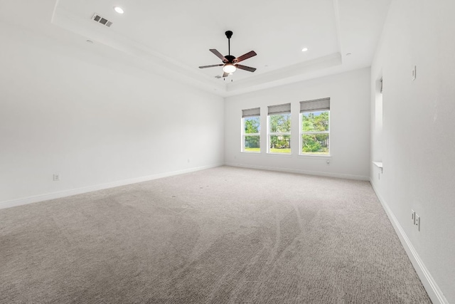 1928 Portobello Rd, Leander, TX 78641 - empty room with a raised ceiling, a ceiling fan, light carpet, and recessed lighting