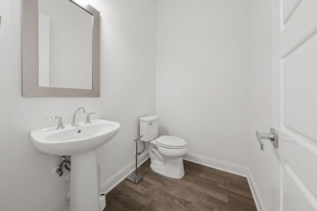 1928 Portobello Rd, Leander, TX 78641 - half bath featuring wood finished floors and toilet