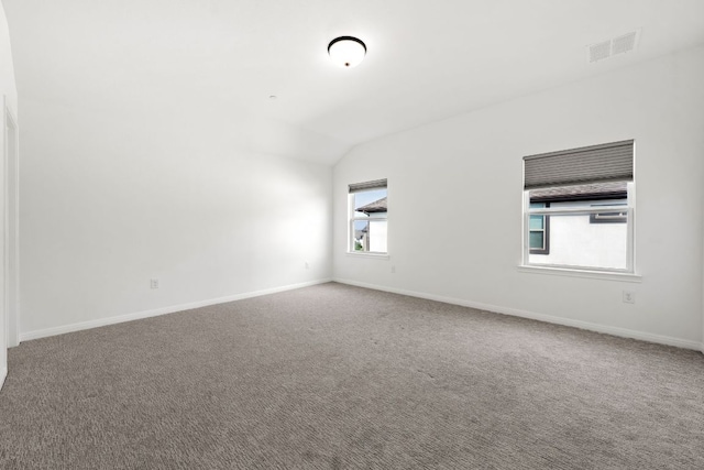 1928 Portobello Rd, Leander, TX 78641 - carpeted empty room featuring vaulted ceiling and baseboards