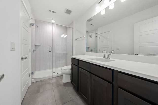 1928 Portobello Rd, Leander, TX 78641 - full bathroom with vanity, a shower stall, and tile patterned floors