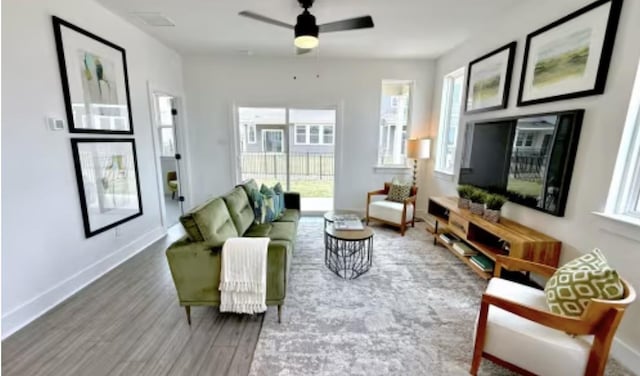 2593 Jack Nora Way, Round Rock, TX 78665 - living room with wood finished floors, ceiling fan, and baseboards