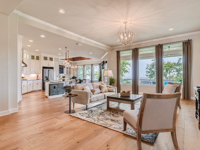 240 Townes Ct, Dripping Springs, TX 78620 - living room featuring a chandelier, ornamental molding, light wood finished floors, recessed lighting, and baseboards