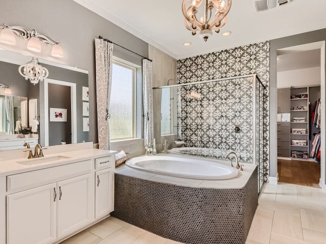 240 Townes Ct, Dripping Springs, TX 78620 - full bathroom with a chandelier, tile patterned floors, a bath, a shower stall, and vanity