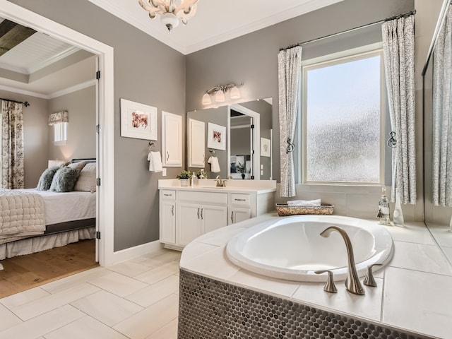 240 Townes Ct, Dripping Springs, TX 78620 - ensuite bathroom with vanity, a bath, ornamental molding, and baseboards
