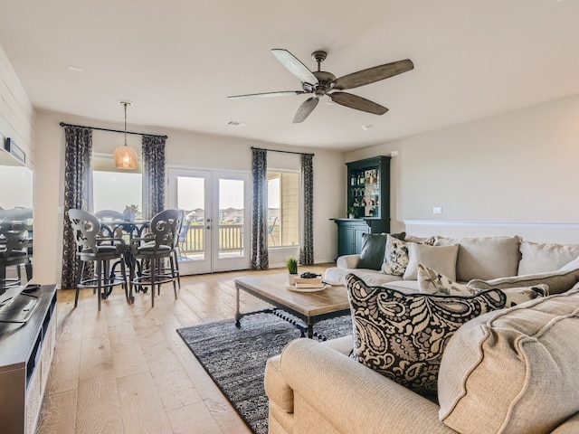 240 Townes Ct, Dripping Springs, TX 78620 - living area featuring light wood-type flooring, a ceiling fan, and french doors