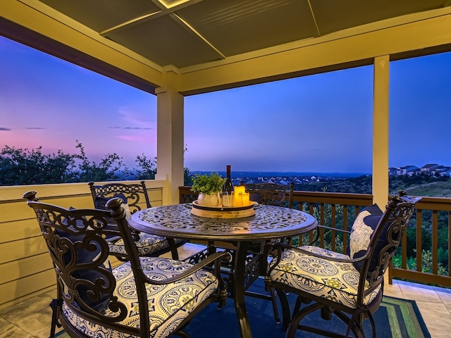 240 Townes Ct, Dripping Springs, TX 78620 - patio terrace at dusk with outdoor dining space and a balcony
