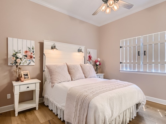 240 Townes Ct, Dripping Springs, TX 78620 - bedroom with light wood-style floors, ornamental molding, baseboards, and ceiling fan