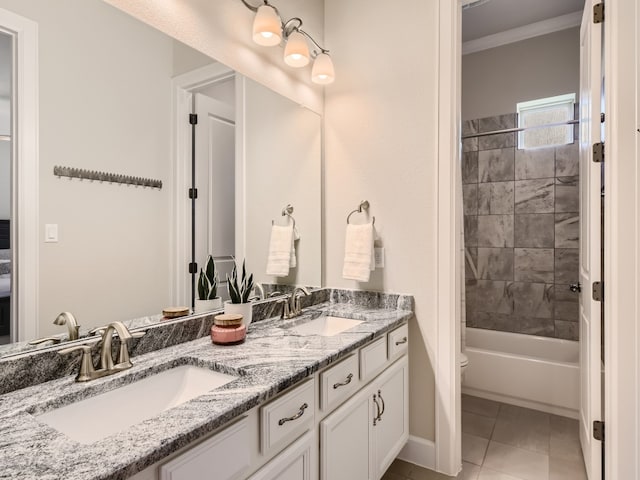 240 Townes Ct, Dripping Springs, TX 78620 - full bathroom featuring double vanity, toilet, crown molding, baseboards, and tile patterned flooring