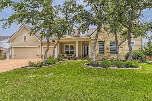 240 Townes Ct, Dripping Springs, TX 78620 - view of front of property with stone siding, concrete driveway, and a front lawn