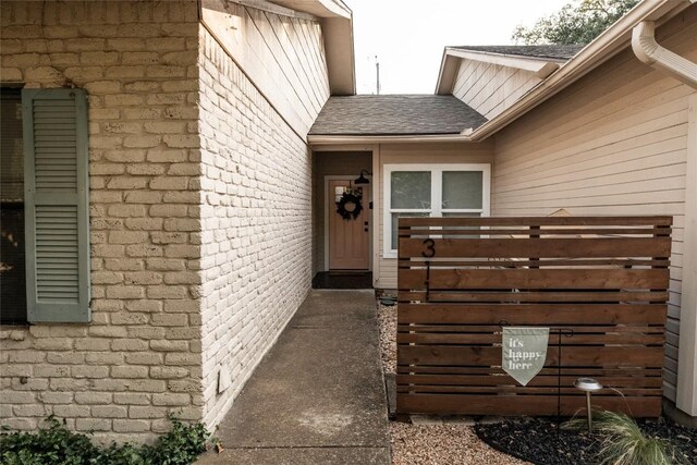 311 Quarry St, San Marcos, TX 78666 - doorway to property with a shingled roof