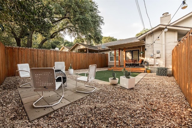 311 Quarry St, San Marcos, TX 78666 - fenced backyard with a patio area