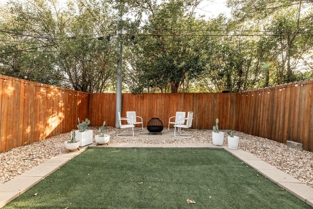 311 Quarry St, San Marcos, TX 78666 - view of yard with a fire pit and a patio