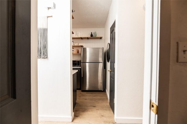 311 Quarry St, San Marcos, TX 78666 - corridor with light wood finished floors and baseboards