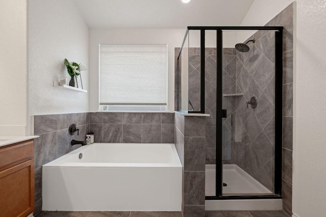 209 Sage Derby Dr, Hutto, TX 78634 - full bath with a shower stall, vanity, and a garden tub