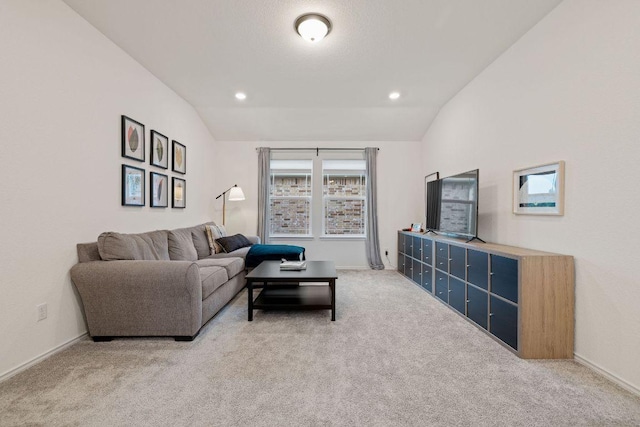 209 Sage Derby Dr, Hutto, TX 78634 - living area featuring light carpet, vaulted ceiling, baseboards, and recessed lighting