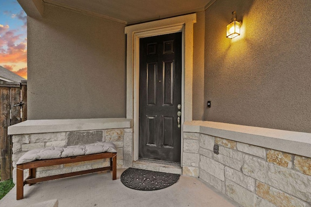209 Sage Derby Dr, Hutto, TX 78634 - property entrance with stucco siding and a porch