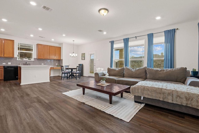 209 Sage Derby Dr, Hutto, TX 78634 - living area with a chandelier, dark wood finished floors, and recessed lighting
