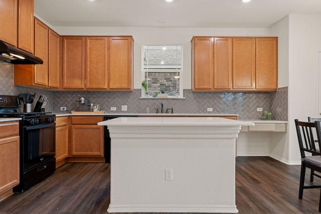 209 Sage Derby Dr, Hutto, TX 78634 - kitchen with gas stove, under cabinet range hood, dark wood finished floors, light countertops, and recessed lighting
