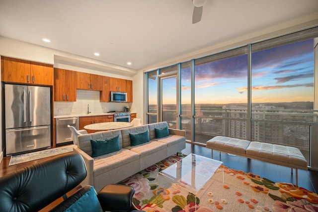 222 W Ave Unit 1908, Austin, TX 78701 - living area with a wall of windows, wood finished floors, recessed lighting, and a ceiling fan