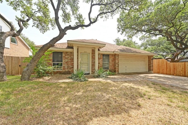 10803 Redgate Ln, Austin, TX 78739 - view of front of property with a garage, concrete driveway, and brick siding
