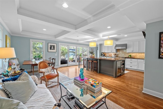 1704 W 34th St, Austin, TX 78703 - living room with light wood-style flooring, plenty of natural light, baseboards, recessed lighting, and coffered ceiling