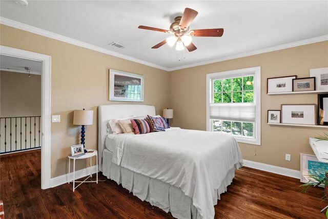 1704 W 34th St, Austin, TX 78703 - bedroom featuring baseboards, wood finished floors, ornamental molding, and a ceiling fan