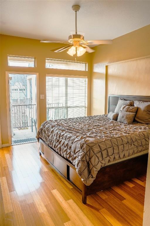 2918 Ranch Road 620th Rd N Unit J162, Austin, TX 78734 - bedroom featuring access to outside, light wood-type flooring, and ceiling fan