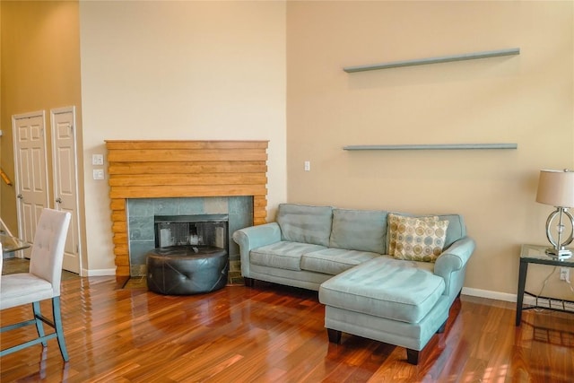 2918 Ranch Road 620th Rd N Unit J162, Austin, TX 78734 - living room featuring wood finished floors, baseboards, and a tile fireplace