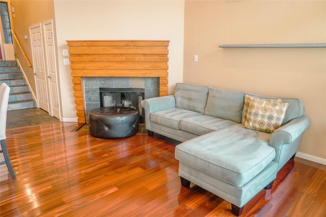 2918 Ranch Road 620th Rd N Unit J162, Austin, TX 78734 - living room with wood finished floors, baseboards, stairs, and a tiled fireplace