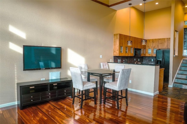 2918 Ranch Road 620th Rd N Unit J162, Austin, TX 78734 - dining room with a high ceiling, dark wood-style flooring, baseboards, recessed lighting, and stairway