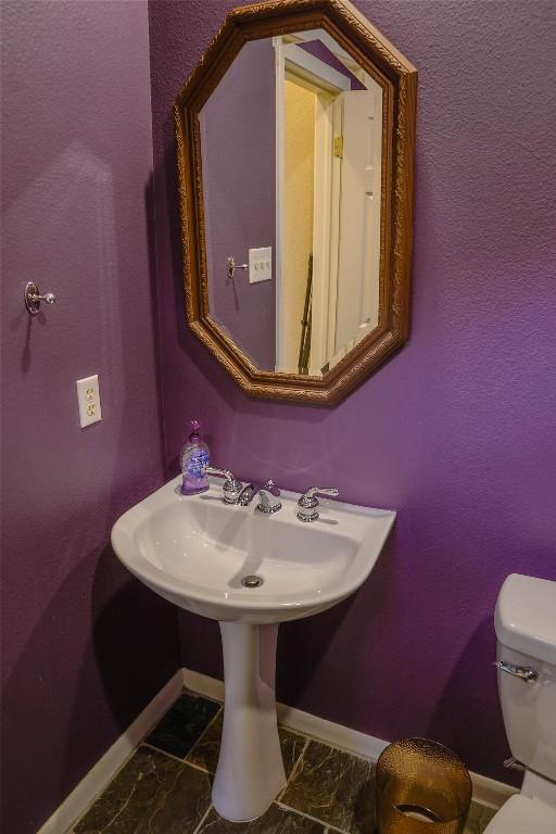 2918 Ranch Road 620th Rd N Unit J162, Austin, TX 78734 - half bathroom with baseboards, toilet, and a sink