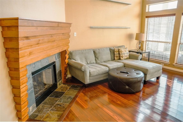 2918 Ranch Road 620th Rd N Unit J162, Austin, TX 78734 - living area featuring a tiled fireplace, wood finished floors, and baseboards