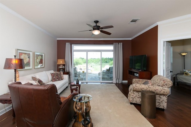 332 Yukon Ter, Georgetown, TX 78633 - living room with dark wood-style flooring, crown molding, a ceiling fan, and baseboards