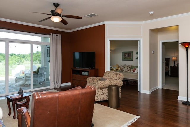 332 Yukon Ter, Georgetown, TX 78633 - living room with dark wood-style flooring, crown molding, baseboards, and a ceiling fan