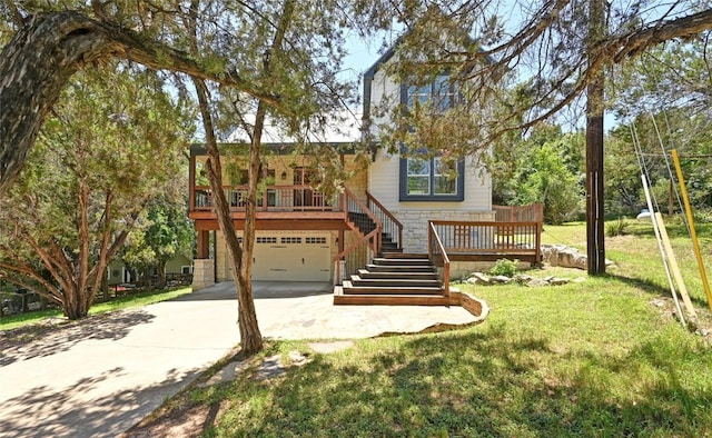 1502 Medio Calle, Austin, TX 78733 - view of front of home featuring stairs, a garage, driveway, a front yard, and stone siding