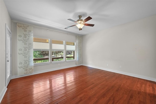 1502 Medio Calle, Austin, TX 78733 - empty room with wood finished floors and ceiling fan