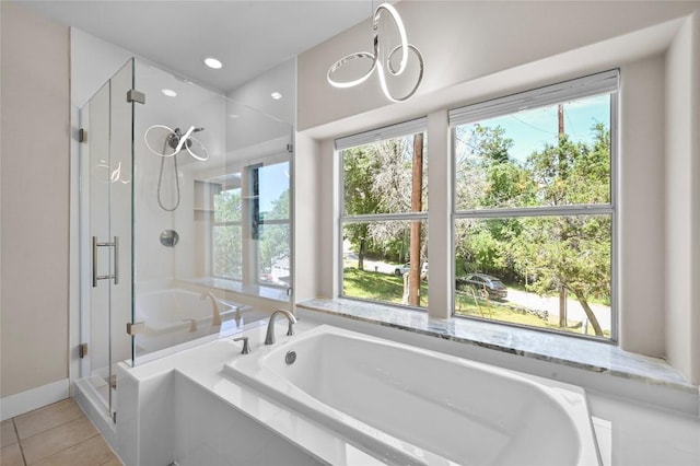 1502 Medio Calle, Austin, TX 78733 - bathroom with a stall shower, a garden tub, and tile patterned floors