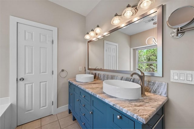 1502 Medio Calle, Austin, TX 78733 - bathroom featuring double vanity and tile patterned floors