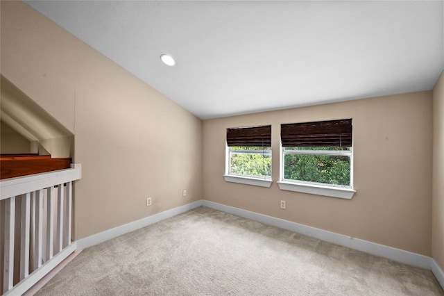 1502 Medio Calle, Austin, TX 78733 - carpeted empty room with baseboards and vaulted ceiling