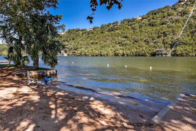 1502 Medio Calle, Austin, TX 78733 - water view with a heavily wooded area