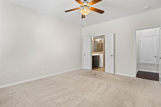 711 Rolling Oak Dr Unit 106, Round Rock, TX 78664 - unfurnished bedroom featuring carpet, baseboards, ensuite bath, and a ceiling fan